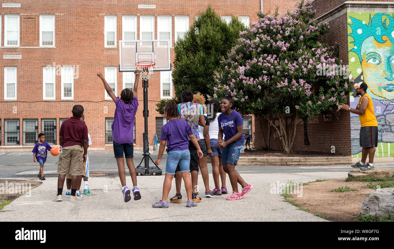 Baltimore school children playing basketball hires stock photography