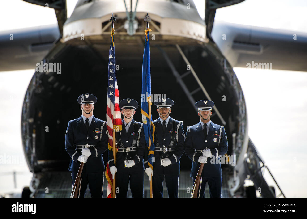 A color guard detail stands in front of a C-5M Super Galaxy in preparation for a retirement ceremony June 1, 2015, at Travis Air Force Base, Calif. Stock Photo