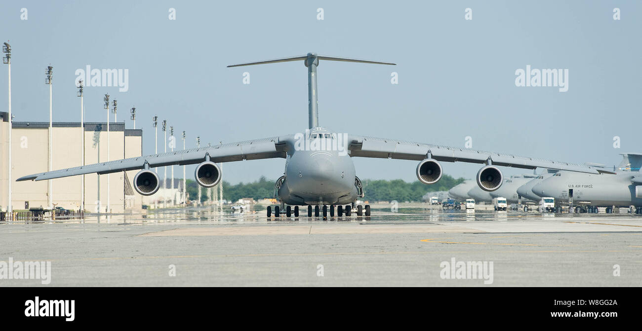 A C-5M Super Galaxy taxies down the flightline prior to takeoff Aug. 17, 2015, at Dover Air Force Base, Del. Eighteen C-5Ms are assigned to Dover AFB. Stock Photo