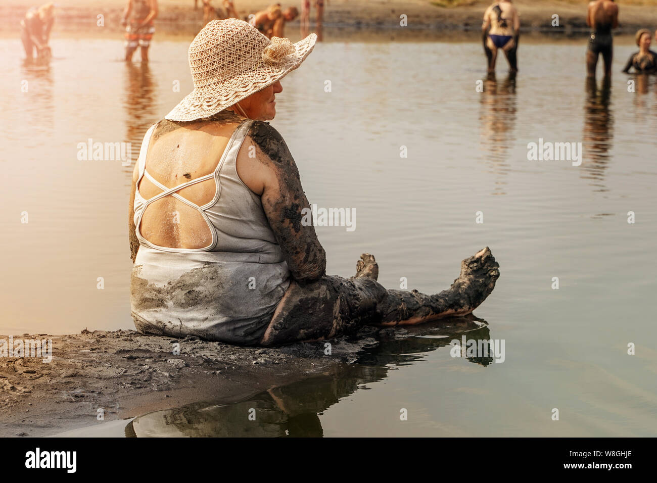 Old girls take mud baths to improve the condition of the skin and