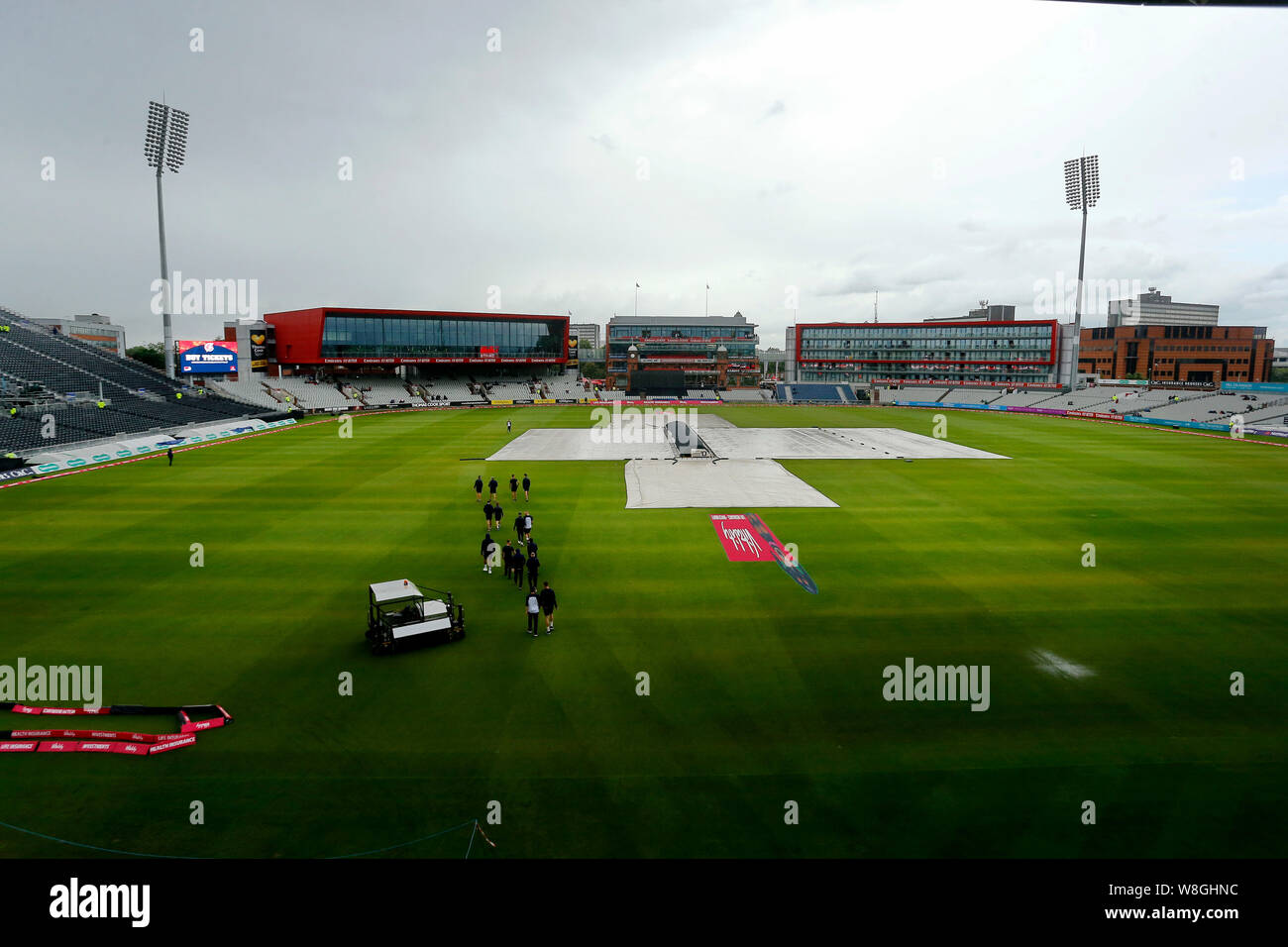 Emirates Old Trafford, Manchester, UK. 9th Aug, 2019. T20 Cricket Lancashire Lightning versus Yorkshire Vikings; Rain falling over Old Trafford and the pitch remains covered with less than an hour to the scheduled start of play - Editorial Use Only Credit: Action Plus Sports/Alamy Live News Stock Photo