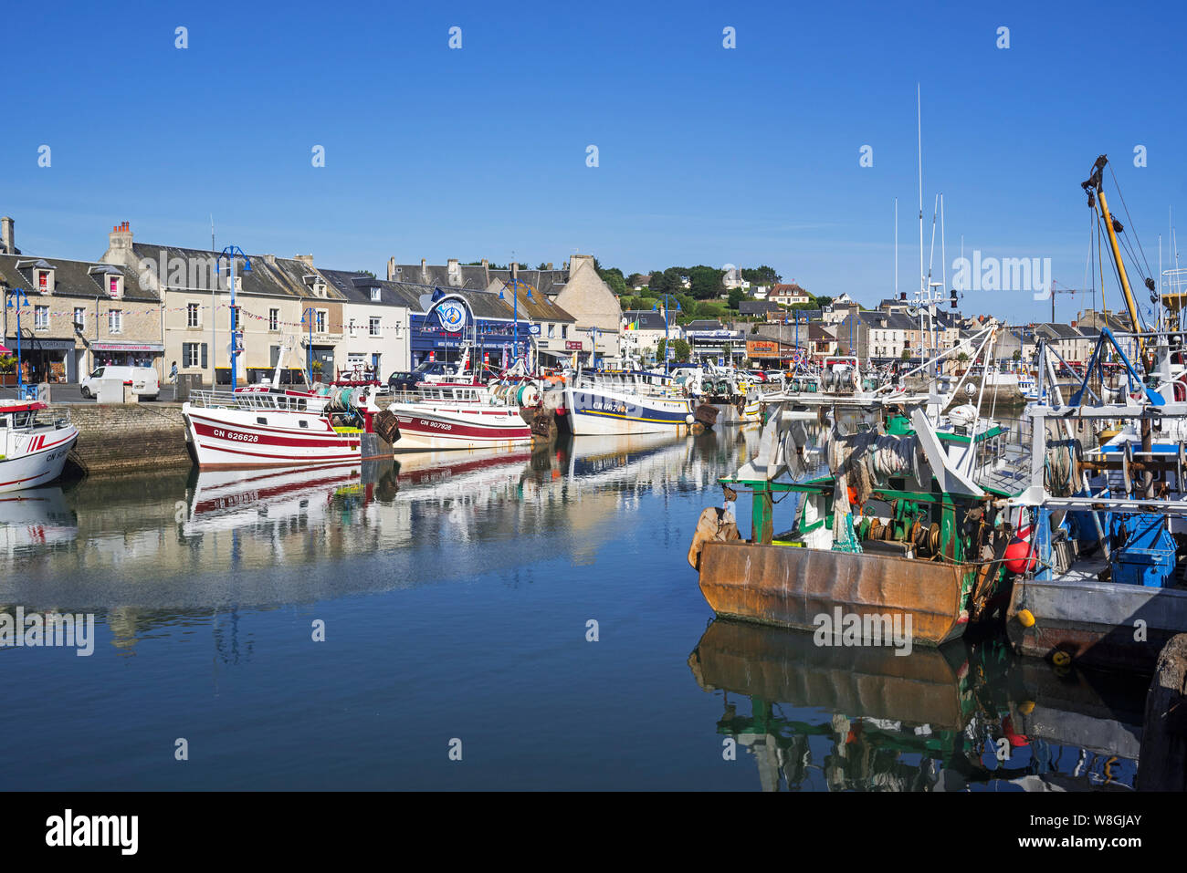 Fishing boats / trawlers docked in the harbour of Port-en-Bessin-Huppain along the English Channel, Calvados, Normandy, France Stock Photo