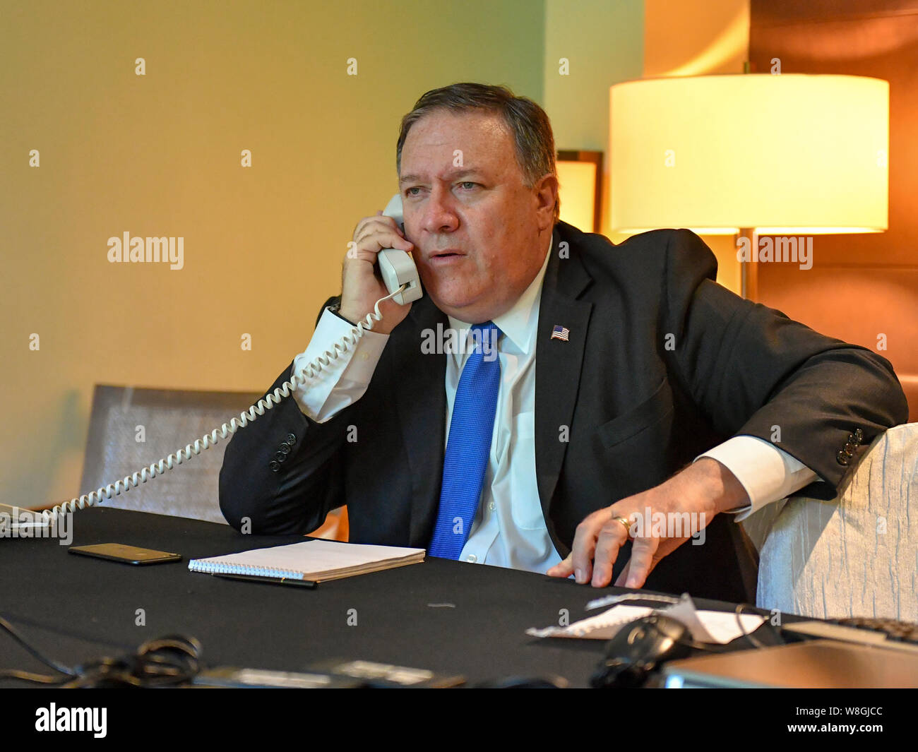 U.S. Secretary of State Mike Pompeo chats with Japanese Foreign Minister Taro Kono and Republic of Korea Foreign Minister Kang Kyung-wha via telephone Stock Photo