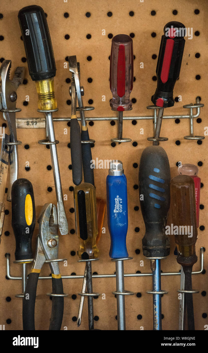 Screwdrivers in a hanging on a pegboard Stock Photo Alamy