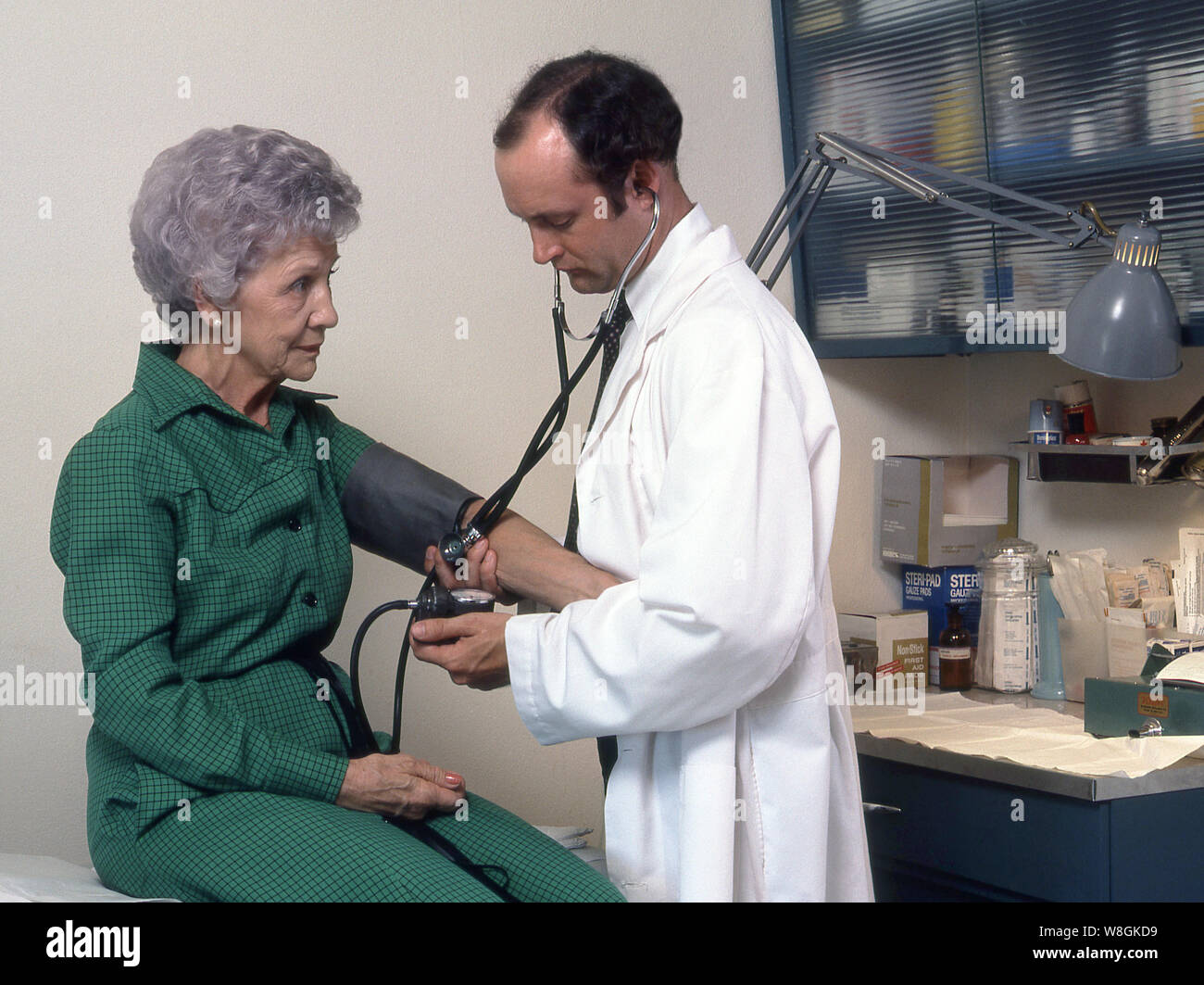 Medical professionals attending to patients Stock Photo