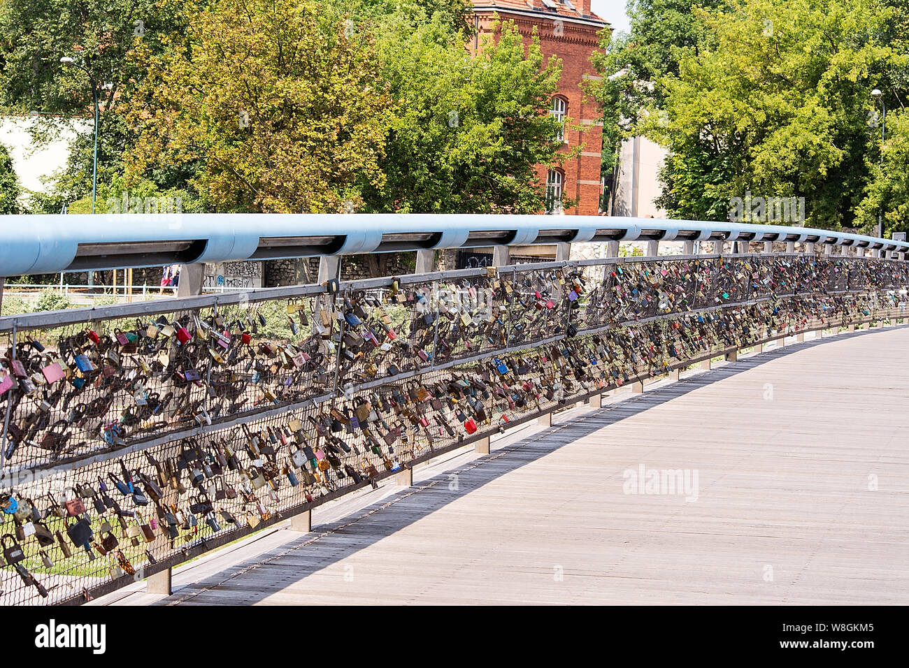 Krakow, Poland 27 July, 2019 Kladka Bernatka Bridge over the Vistula river with a attached