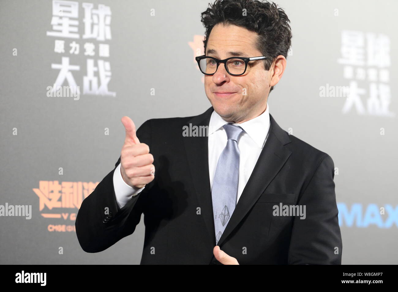 American director J. J. Abrams poses during a premiere for his movie 'Star Wars: The Force Awakens' in Shanghai, China, 27 December 2015. Stock Photo