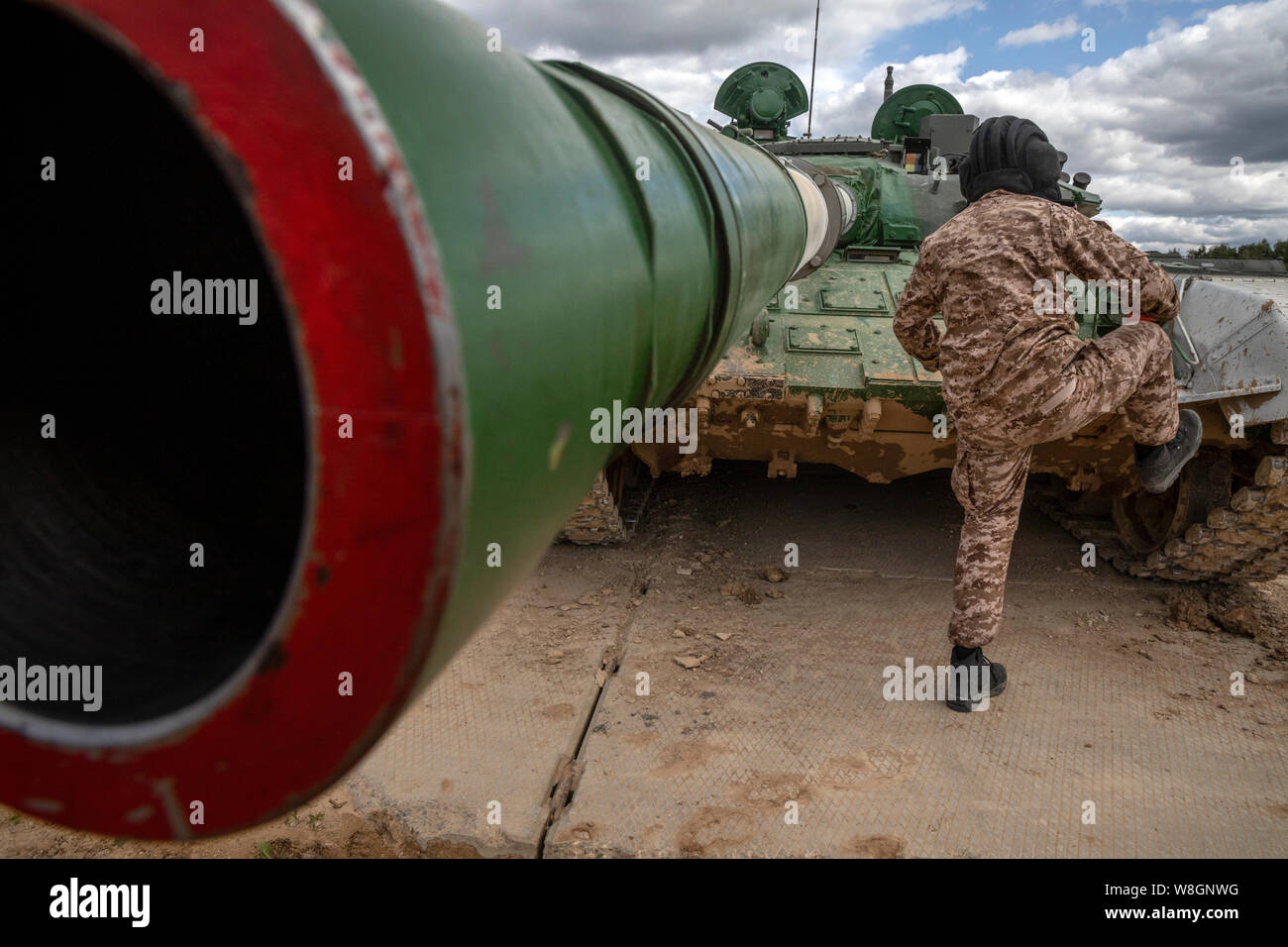 A tankman gets on Russian tank Stock Photo