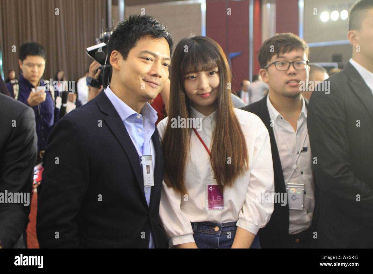 American actor Archie Kao, left, poses during the 1st "SHAPE China 2015" summit ahead of the "Summer Davos" Forum in Dalian city, northeast China's Li Stock Photo