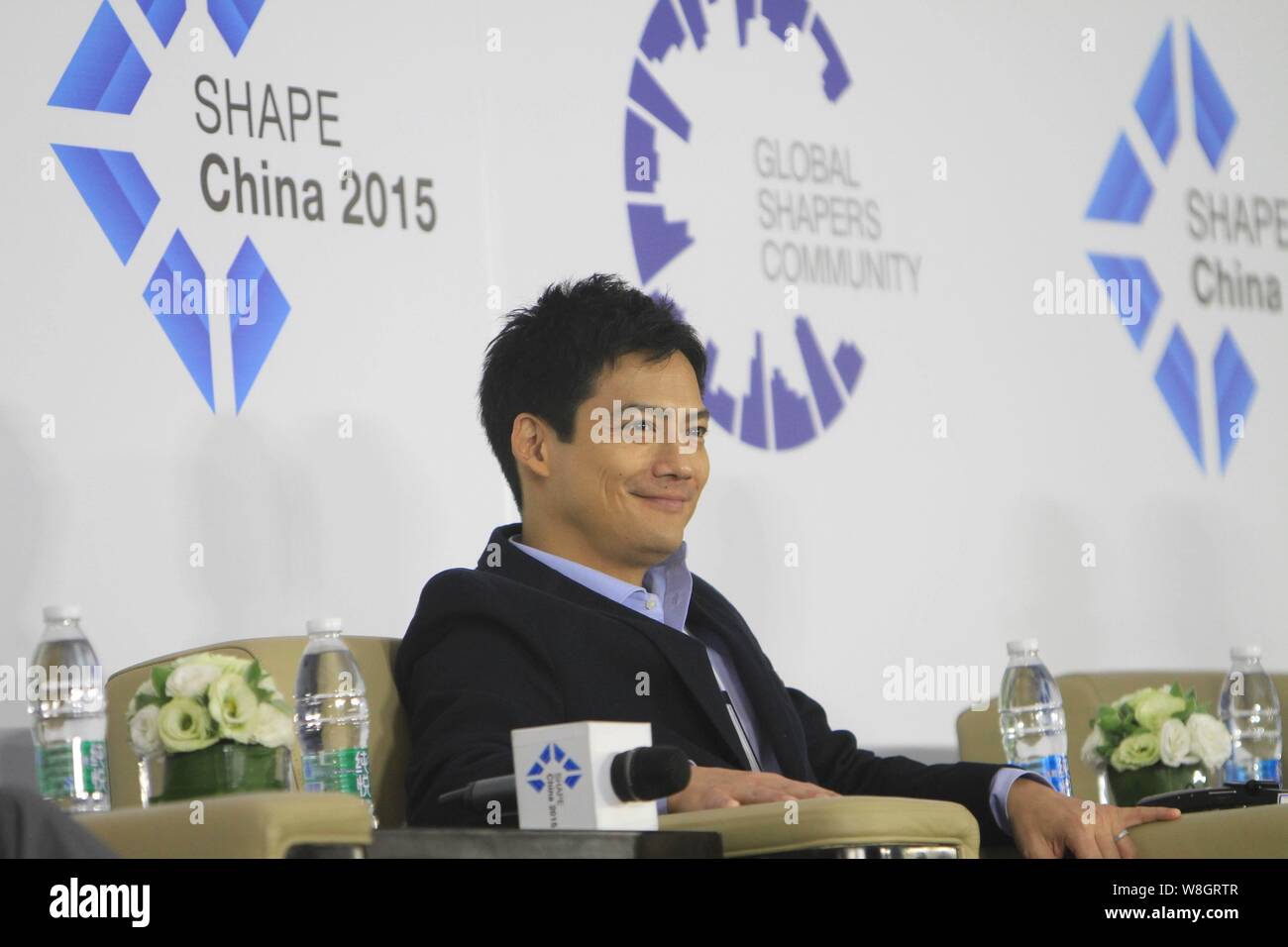 American actor Archie Kao smiles during the 1st "SHAPE China 2015" summit ahead of the "Summer Davos" Forum in Dalian city, northeast China's Liaoning Stock Photo