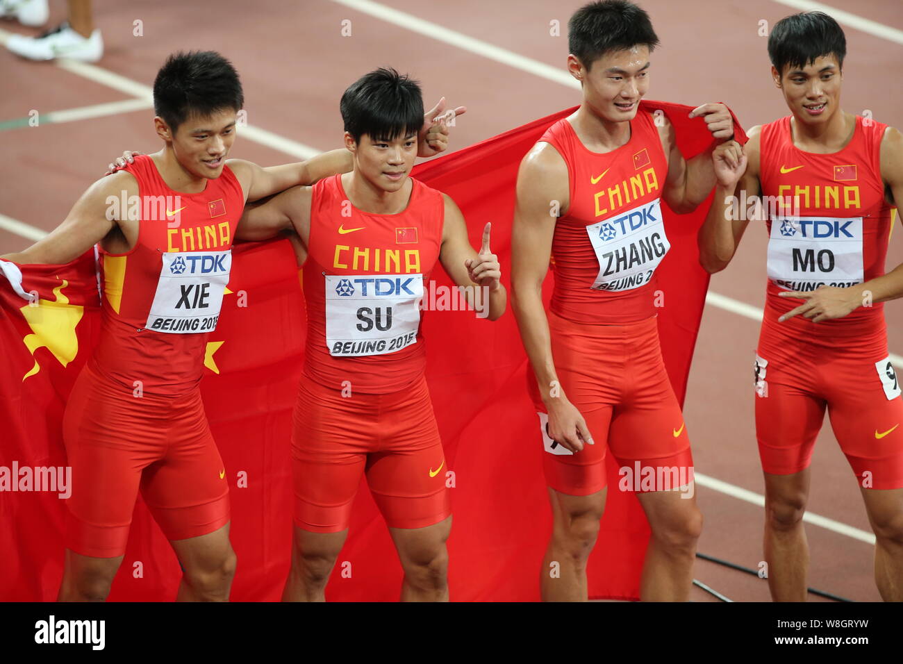 (From left) Xie Zhenye, Su Bingtian, Zhang Peimeng and Mo Youxue of China's men's 4x100m relay team celebrate after winning the runner-up of the men's Stock Photo