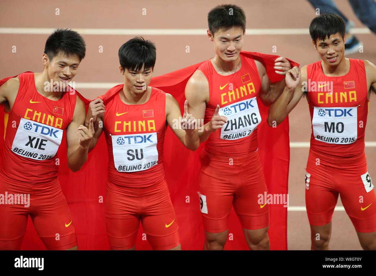 (From left) Xie Zhenye, Su Bingtian, Zhang Peimeng and Mo Youxue of China's men's 4x100m relay team celebrate after winning the runner-up of the men's Stock Photo