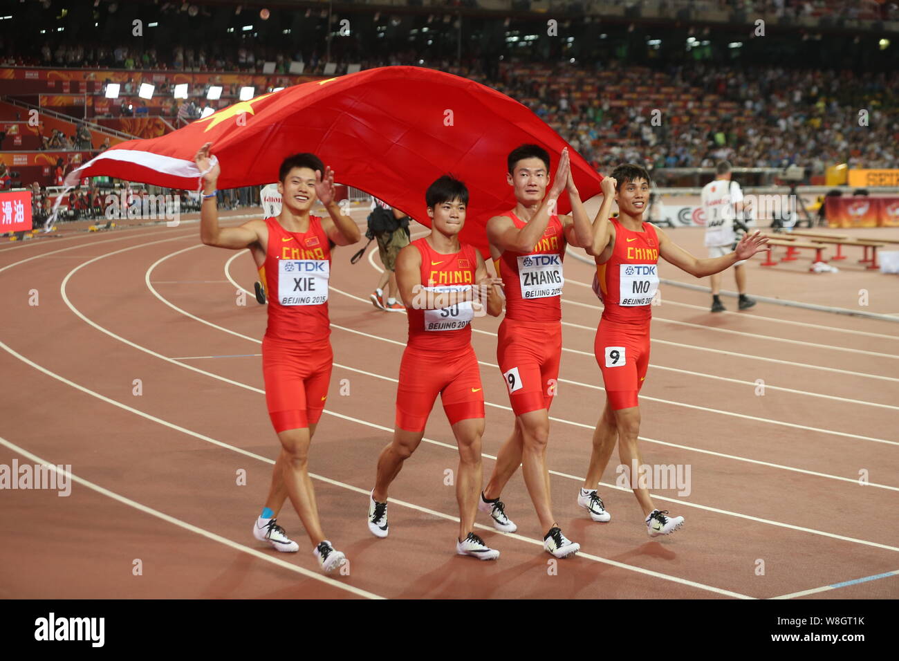 (From left) Xie Zhenye, Su Bingtian, Zhang Peimeng and Mo Youxue of China's men's 4x100m relay team celebrate after winning the runner-up of the men's Stock Photo