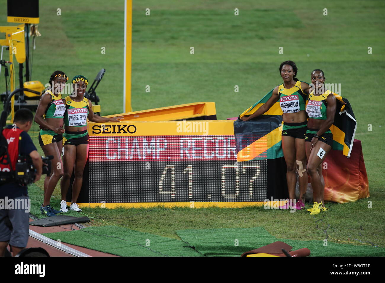 (From left) Elain Thompson, Shelly-Ann Fraser-Pryce, Natasha Morrison and Veronica Campbell-Brown pose for photos with a signboard of champion record Stock Photo