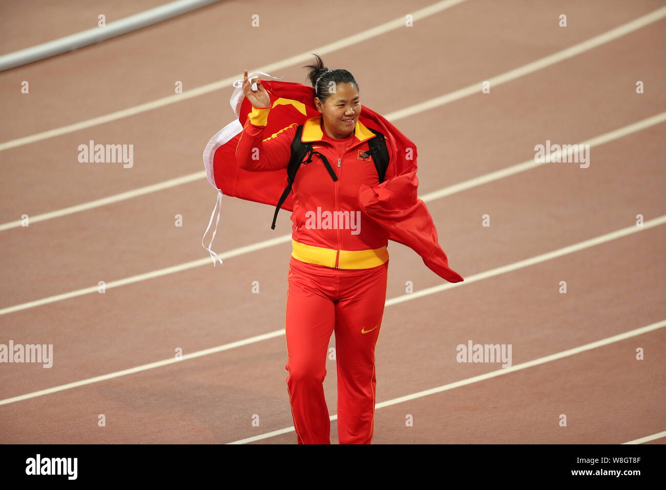 China's Zhang Wenxiu celebrates after winning the silver medal of the