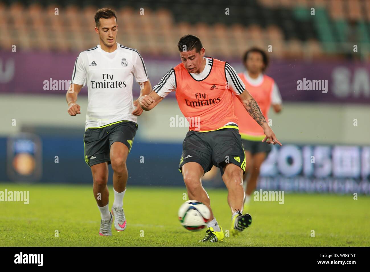 James Rodriguez, right, and teammates of Real Madrid take part in a training session in Guangzhou city, south China's Guangdong province, 26 July 2015 Stock Photo