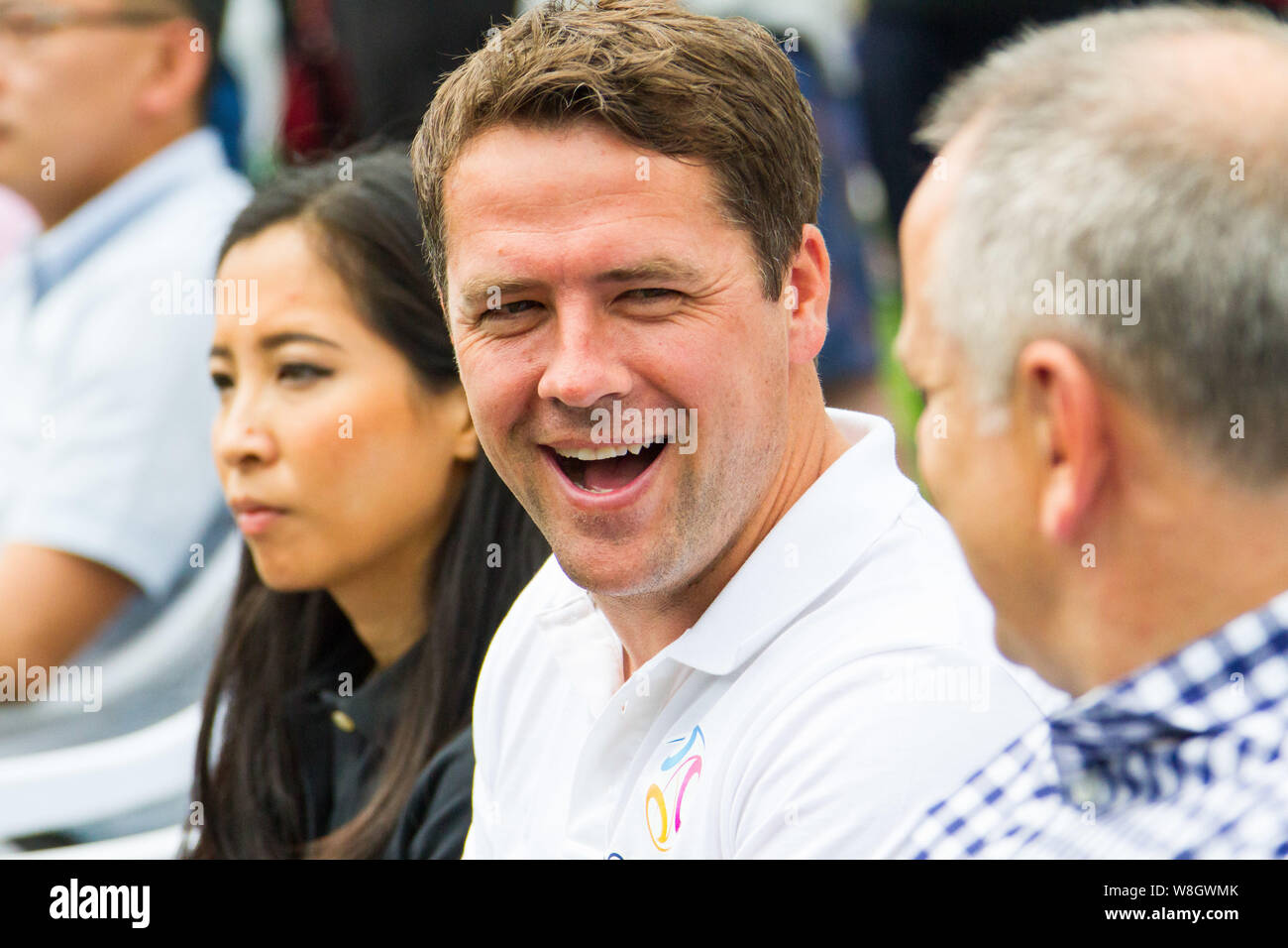 Retired English football star Michael Owen, center, smiles during the opening ceremony for the SoccerWorld Summer Football Festival in Nanjing city, e Stock Photo