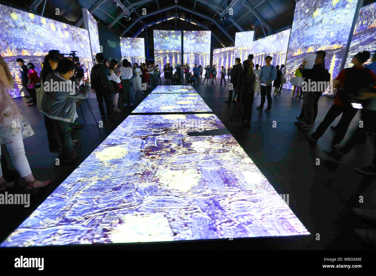 Visitors enjoy a multimedia exhibit of Dutch artist Vincent Van Gogh¯s ...