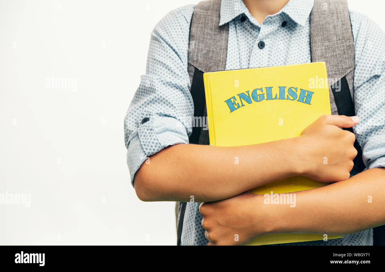 Kid with schoolbag and English books closeup Stock Photo