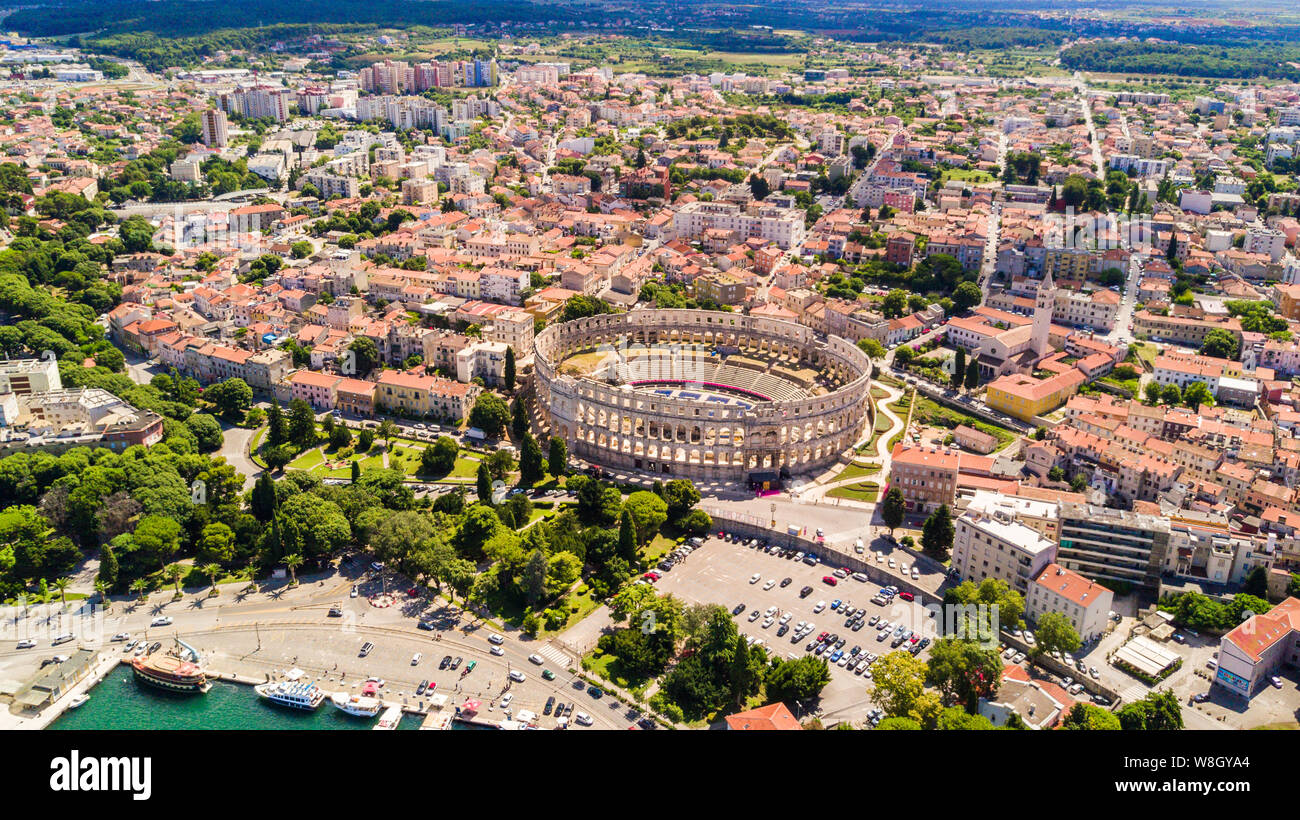 Pula aerial drone shot. The Arena is the only remaining Roman amphitheatre to have four side towers and with all three Roman architectural orders enti Stock Photo