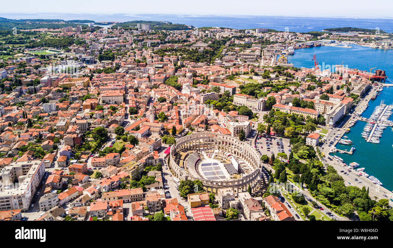 Pula aerial drone shot. The Arena is the only remaining Roman amphitheatre to have four side towers and with all three Roman architectural orders enti Stock Photo
