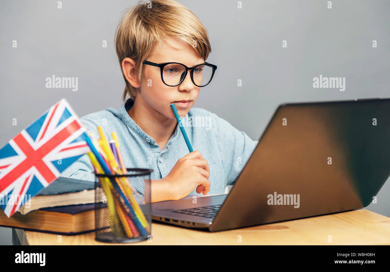 Thoughtful young student thinking while studying English Stock Photo