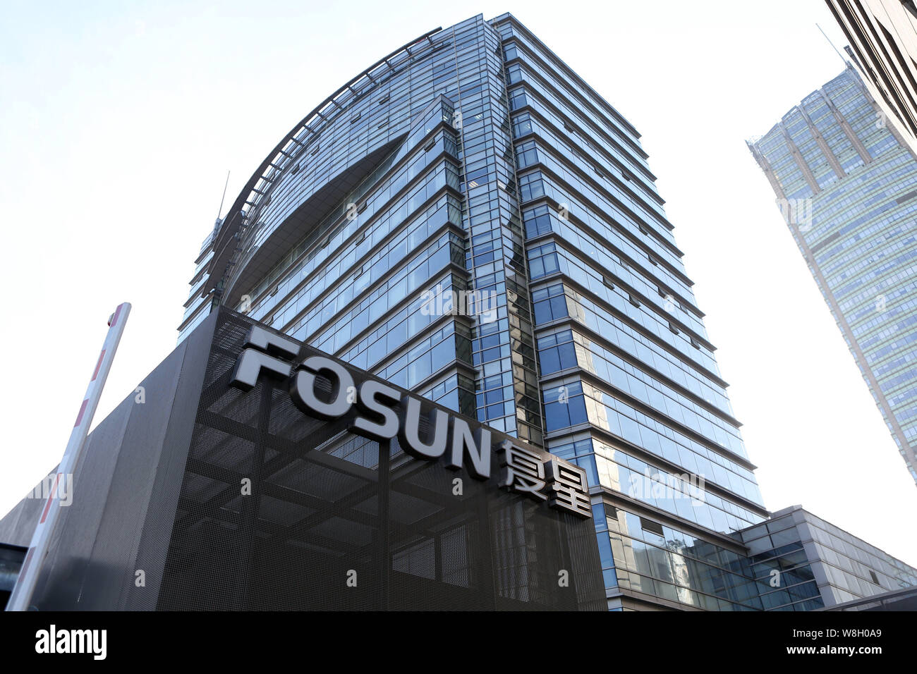 --FILE--View of the headquarters building of Fosun Group in Shanghai, China, 2 December 2014.     Fosun International Ltd., owner of One Chase Manhatt Stock Photo