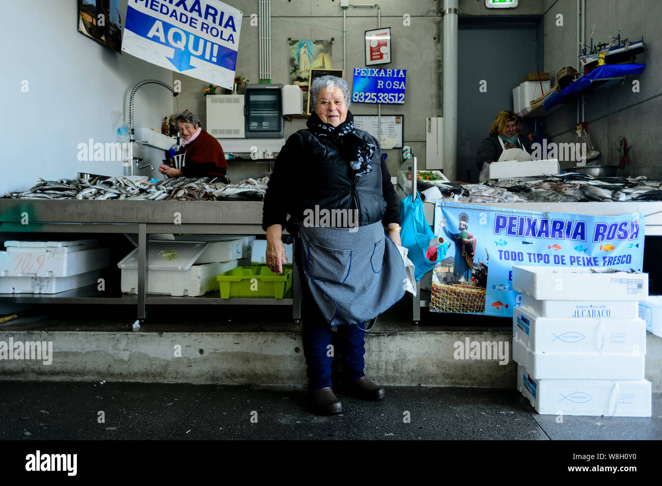 Woman at fish market in Afurada Stock Photo