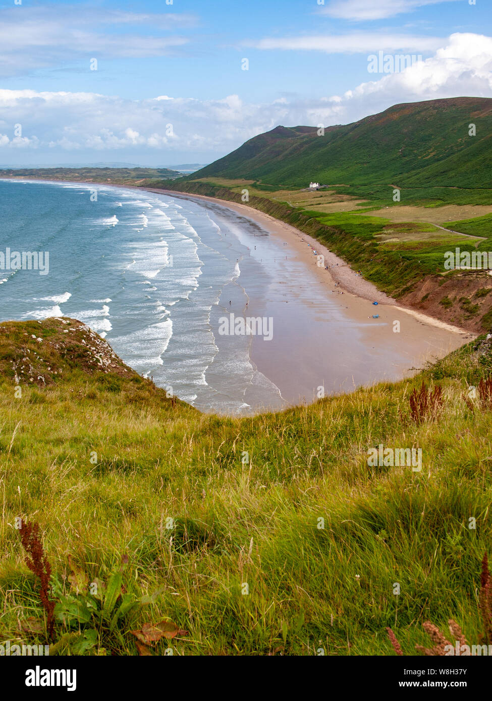 Rhossili Bay looking north towards Llangennith beach from the clifftops. Rhossili Down is above the bay on the right. AONB, Gower, Wales, UK. Stock Photo