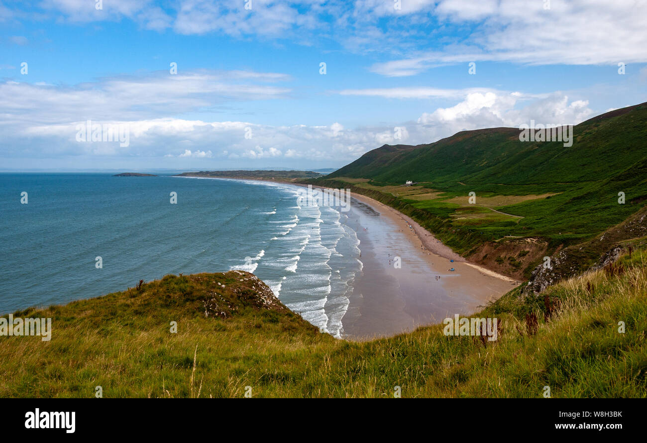 Rhossili Bay looking north towards Llangennith beach from the clifftops. Rhossili Down is above the bay on the right. AONB, Gower, Wales, UK. Stock Photo