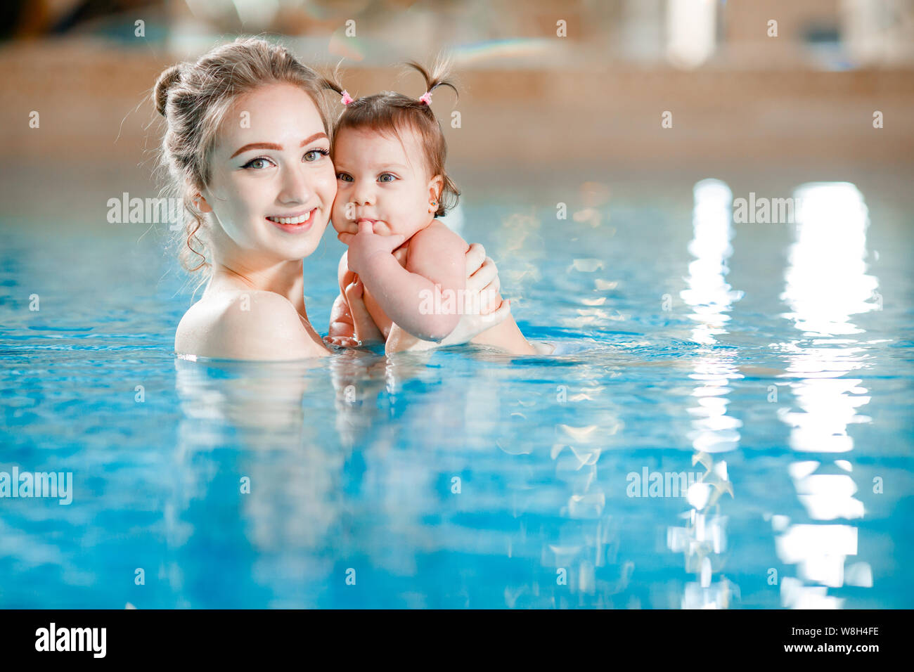 Mom and baby swim in the pool Stock Photo Alamy