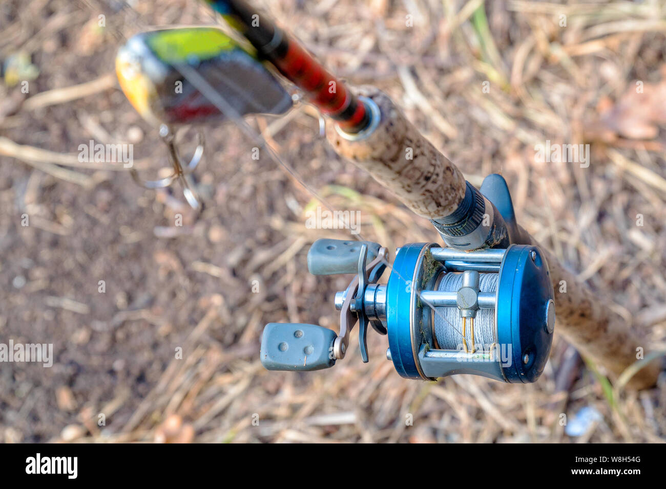 Spinning rod with baitcasting reel and bait Stock Photo - Alamy