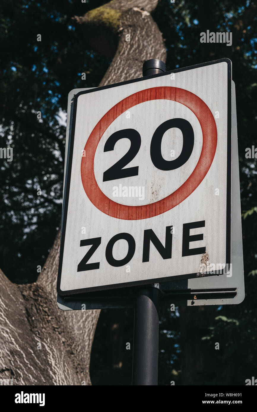Twenty miles per hour speed limit zone sign on the road in Brixton, Borough of Lambeth, London, UK. Stock Photo