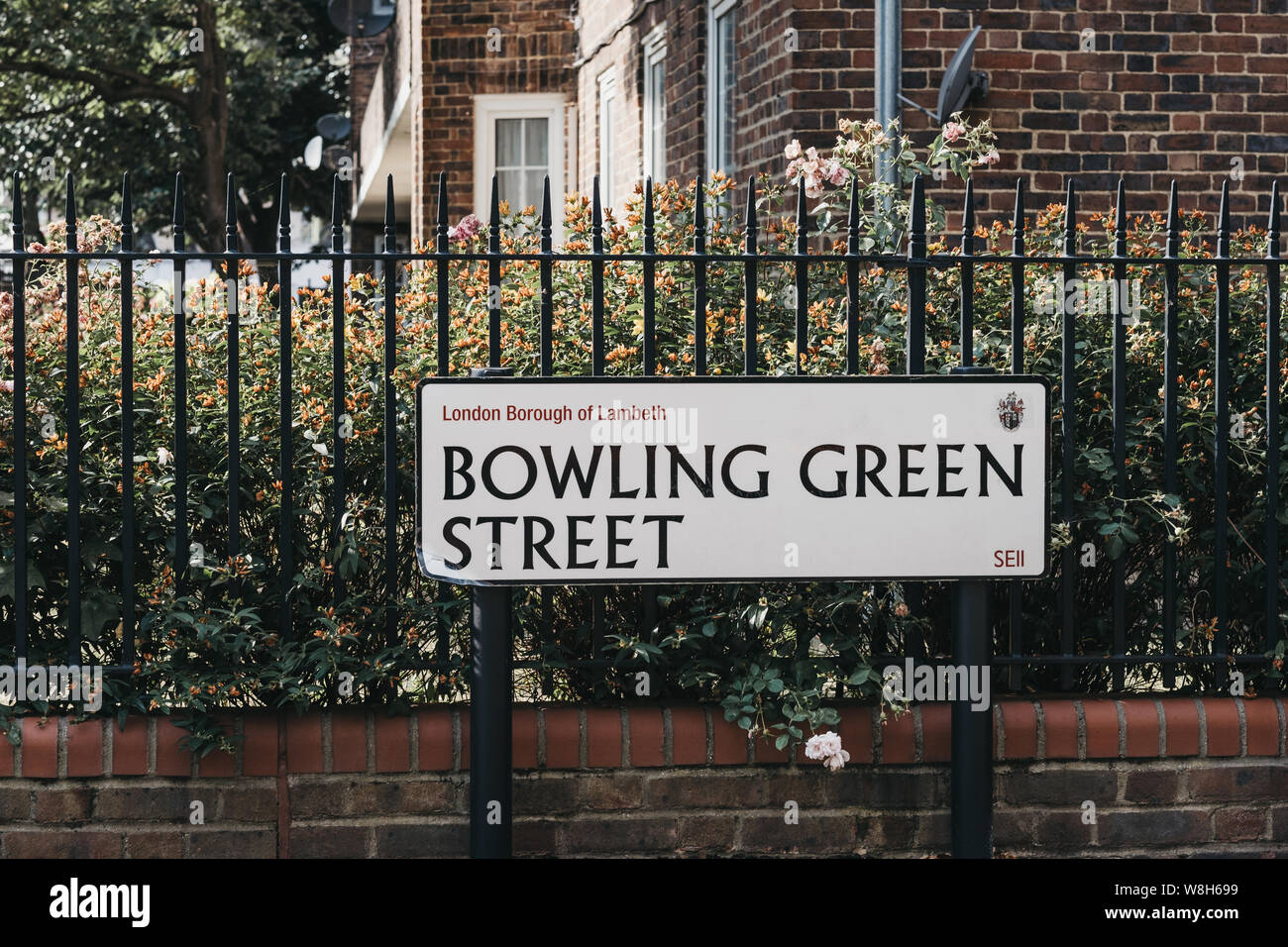 London, UK - July 16, 2019: Street name sign on a fence in Bowling Green Street in Lambeth, a borough in South London, England, which forms part of In Stock Photo