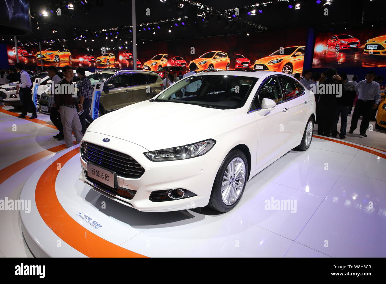 --FILE--Visitors look at a Ford New Mondeo during the 12th China (Guangzhou) International Automobile Exhibition, known as Auto Guangzhou 2014, in Gua Stock Photo