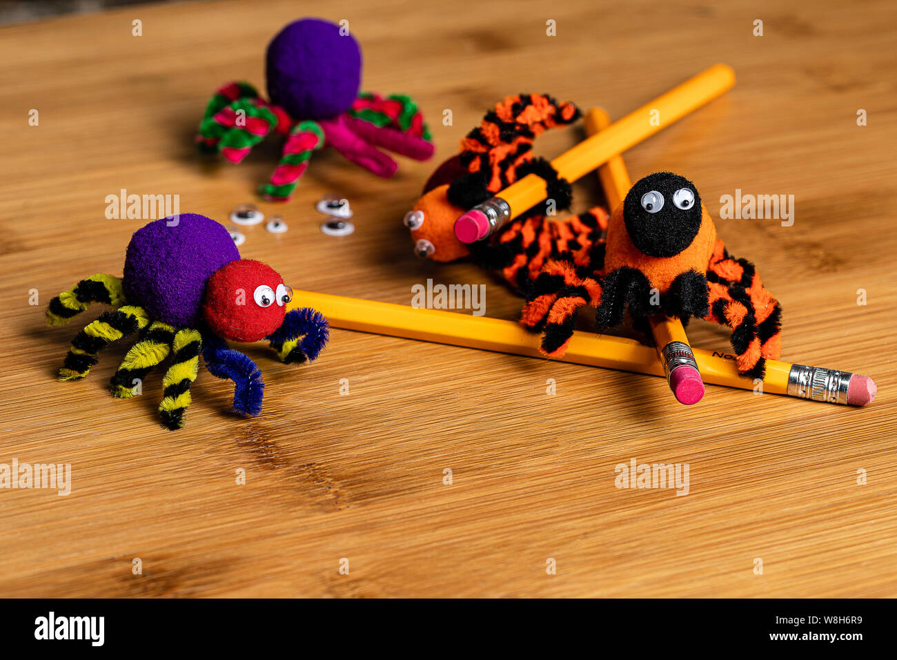 Fun Halloween Crafts. Spiders made of pom poms and pipe cleaners