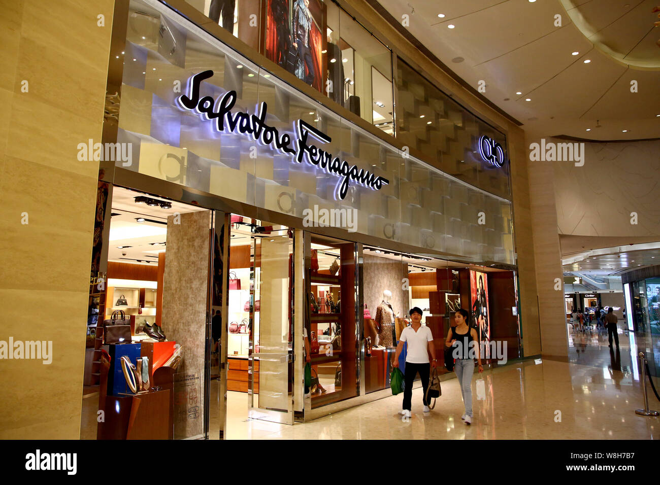 FILE--Pedestrians walk past a boutique of Salvatore Ferragamo at a shopping  mall in Shanghai, China, 1 September 2015. The chief executive of Ital  Stock Photo - Alamy