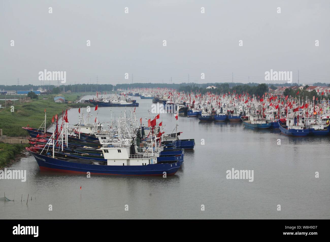 Fishing boats docked at the Qingkou port as Typhoon Chan-Hom and Typhoon Linfa approach in Lianyungang city, east China's Jiangsu province, 9 July 201 Stock Photo