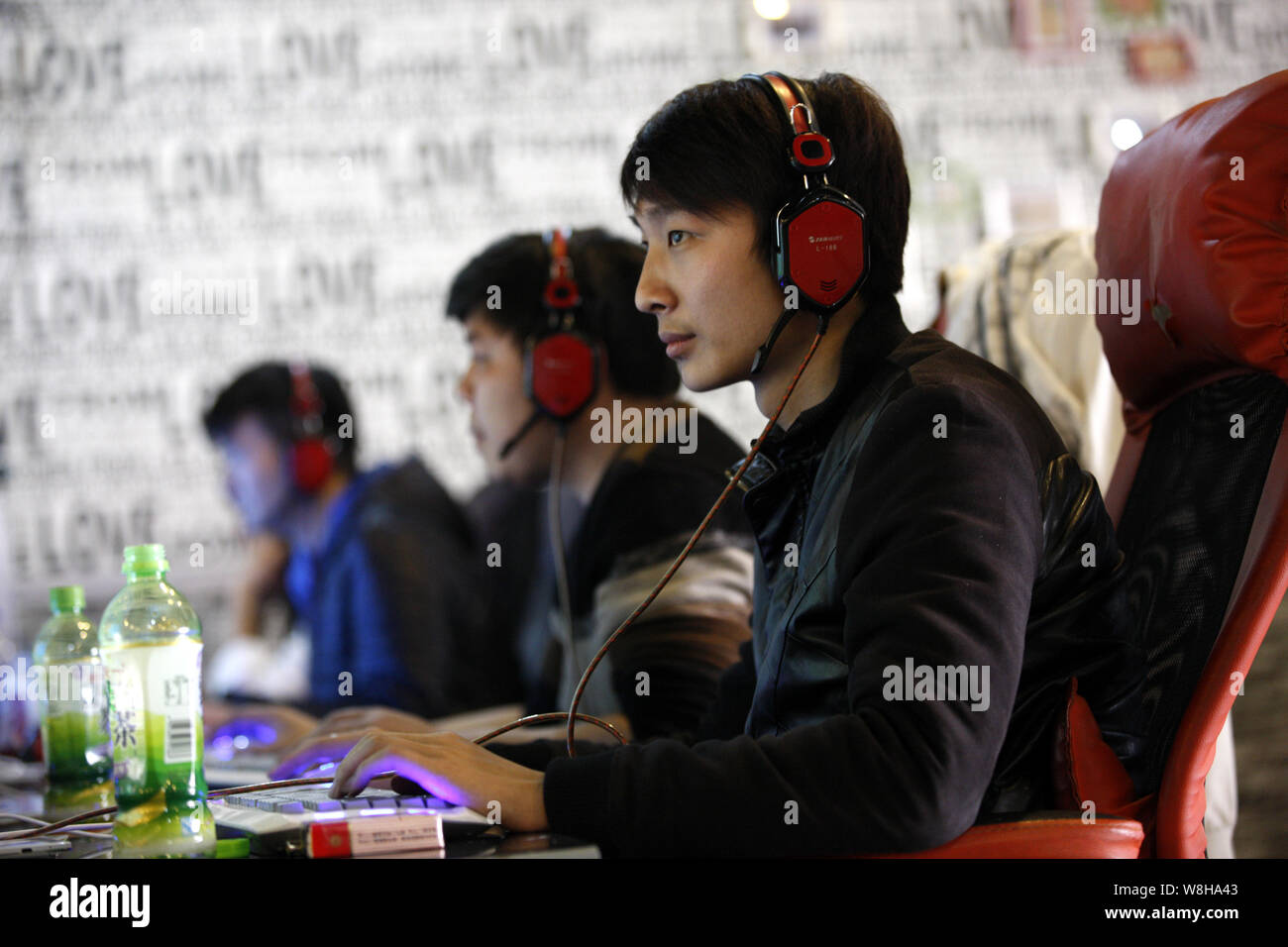 --FILE--Young Chinese people play online games or surf the Internet at an Internet cafe in Huaibei city, east China's Anhui province, 22 March 2015. Stock Photo