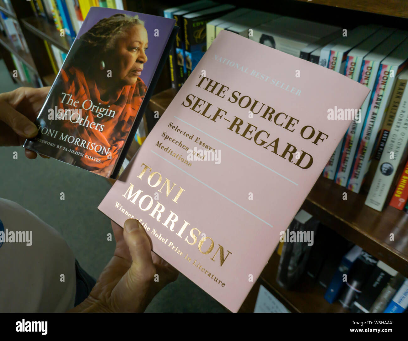 A reader browses copies of Toni Morrison's “The Origin of Others” and “The  Source of Self-Regard” in a bookstore in New York on Tuesday, August 6,  2019. Morrison passed away in New