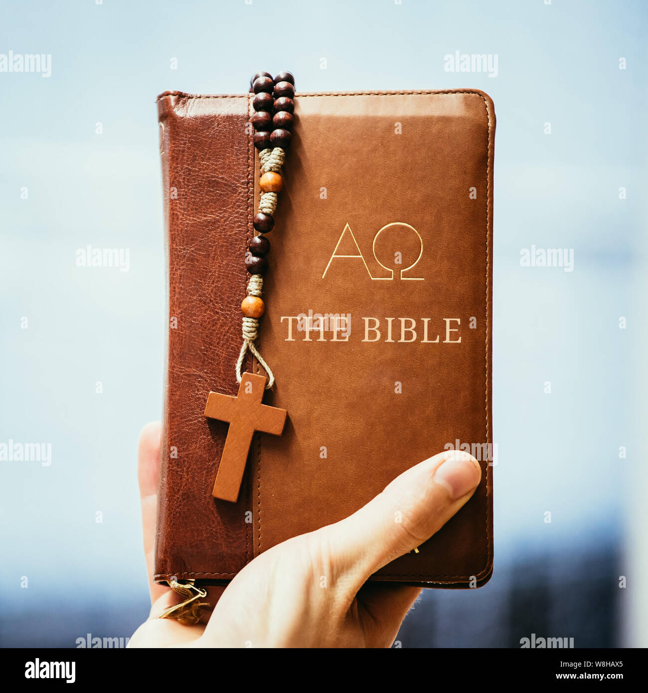 Young preacher is holding the holy bible, praying Stock Photo - Alamy