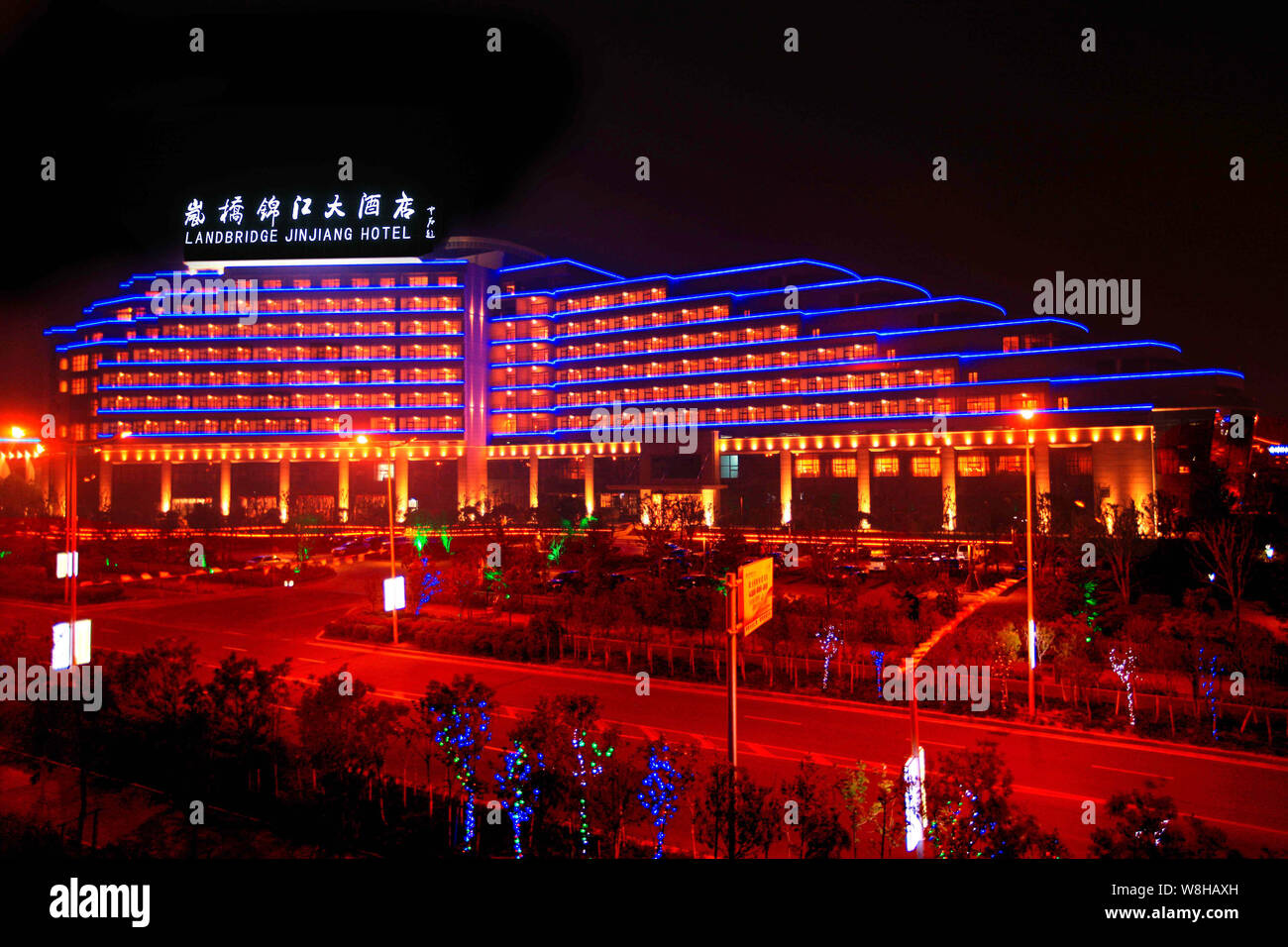 --FILE--Night view of the Landbridge Jin Jiang Hotel in Rizhao city, east China's Shandong province, 8 May 2014.   Shanghai Jin Jiang International Ho Stock Photo