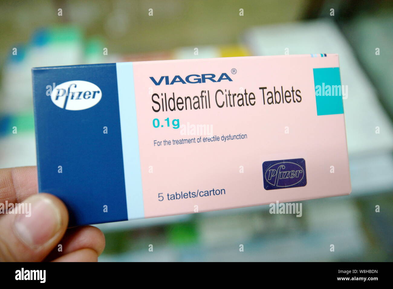 FILE--A man shows a box of Viagra sildenafil citrate tablets of Pfizer at a  pharmacy in Shanghai, China, 19 November 2012. Chinese police have ope  Stock Photo - Alamy