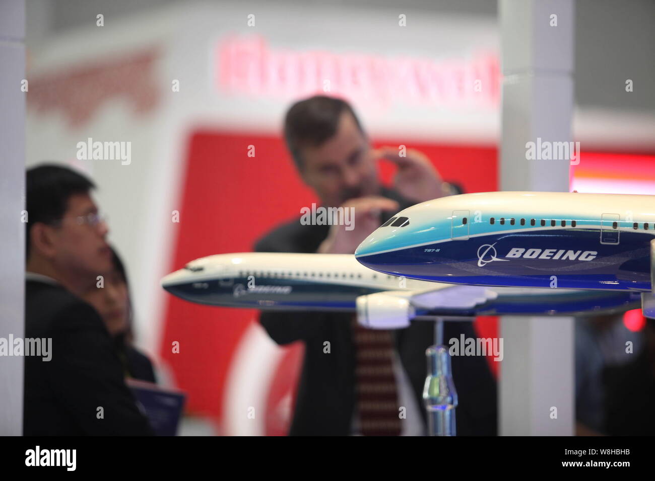 --FILE--A foreign employee introduces Boeing planes to visitors during the Aviation Expo China 2011 in Beijing, China, 21 September 2011.   Boeing Co Stock Photo