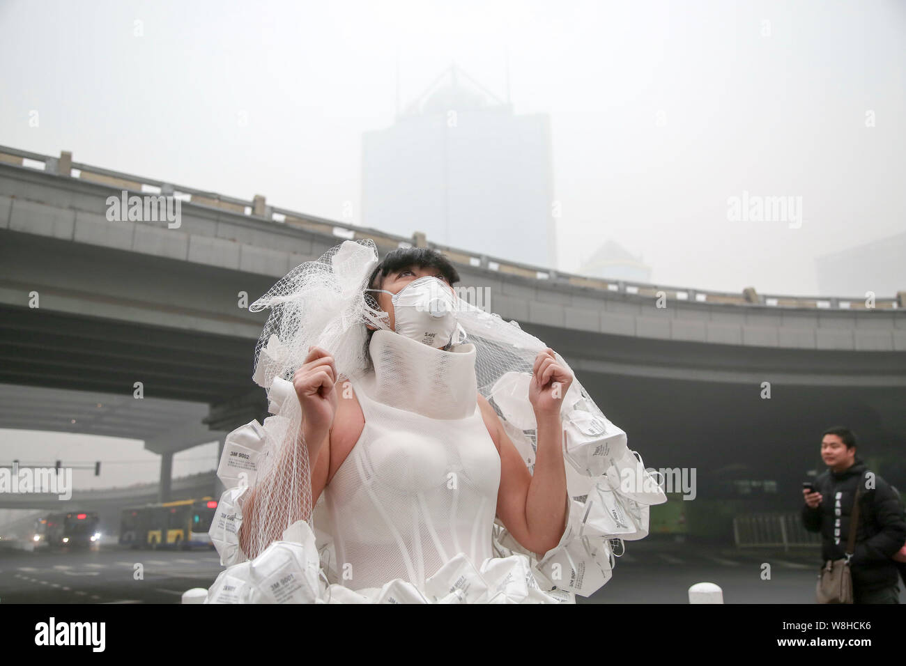 Chinese Artist Kong Ning Wearing A Face Mask And A Wedding Dress