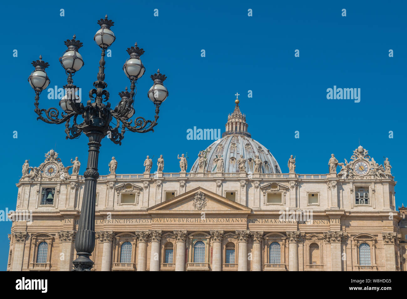 Lampposts of St. Peter's Square and Basilica in the background Stock Photo