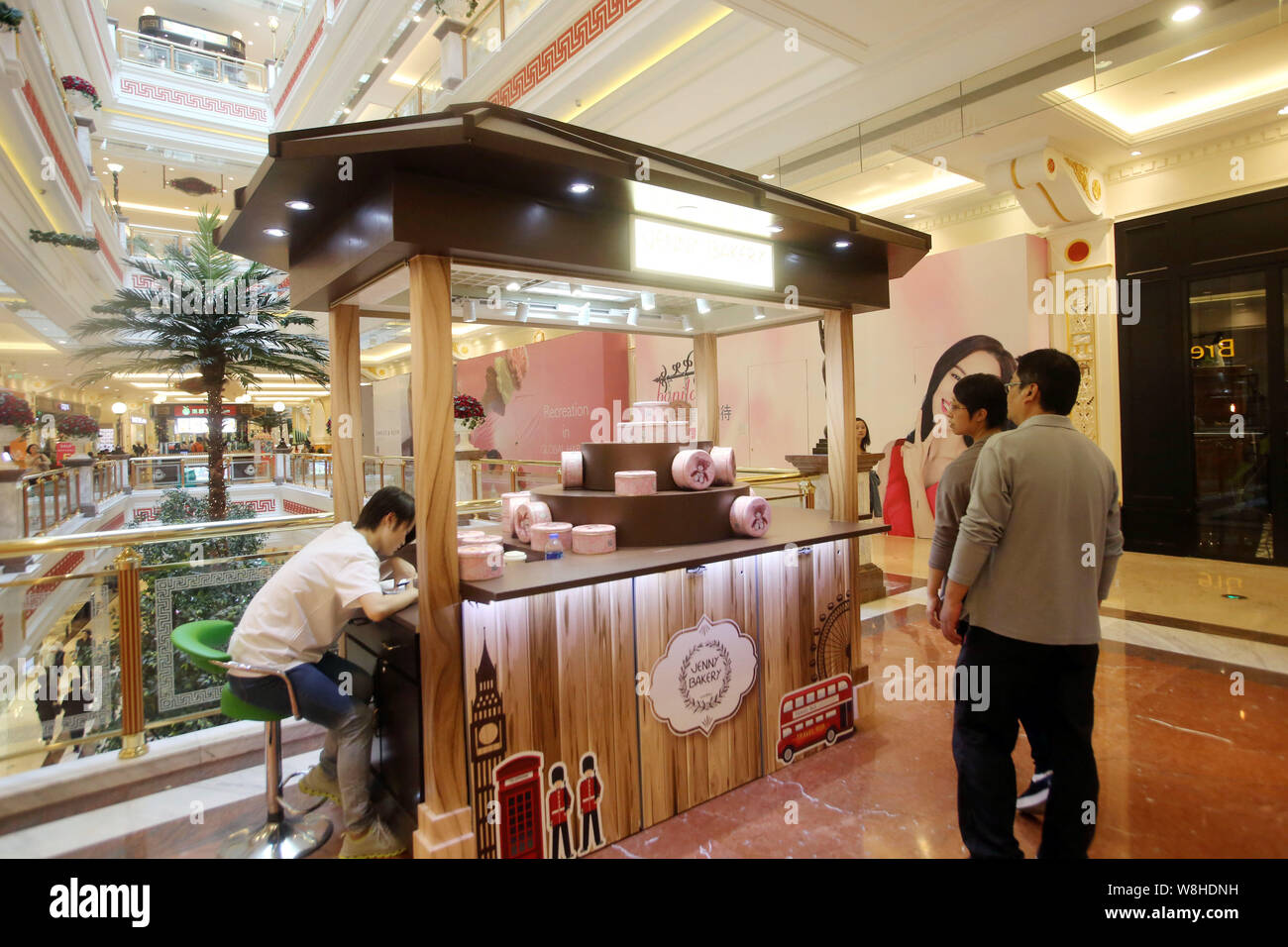 Customers are seen at the JENNY BAKERY store in the Global Harbor shopping mall in Putuo District, Shanghai, China, 26 October 2015.   Putuo District Stock Photo