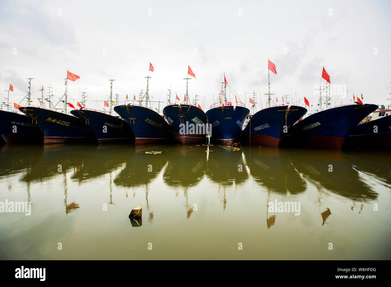 Fishing boats docked at the Qingkou port as Typhoon Chan-Hom and Typhoon Linfa approach in Lianyungang city, east China's Jiangsu province, 9 July 201 Stock Photo