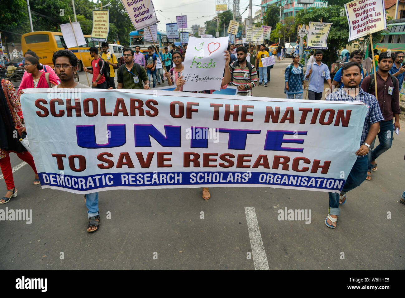 Indian students and scientists hold a banner and placards during the India March for Science in Kolkata.Scientists, scholars and students participate in 'India March for Science' to uphold their various demands like 3% and 10% of GDP allocation for science and education, and raising voice against policymakers pursuing policies that ignore scientific evidence. Stock Photo
