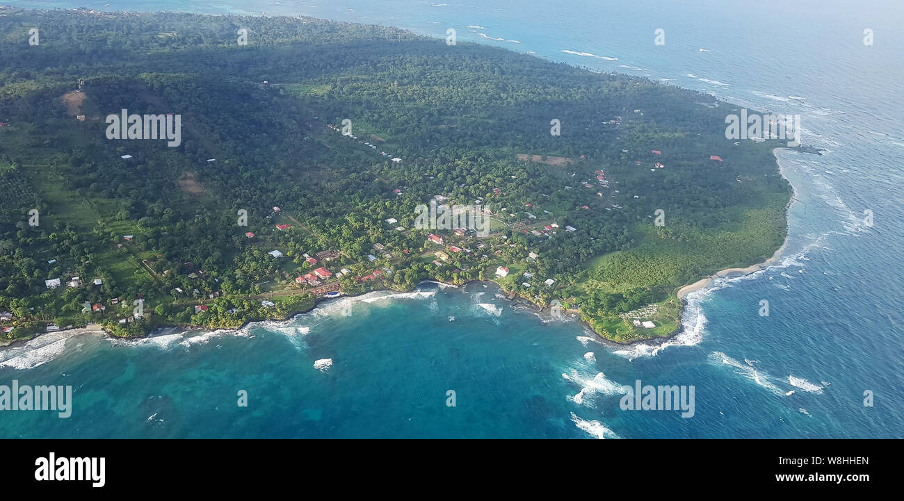 Green island on sunny day aerial drone view Stock Photo